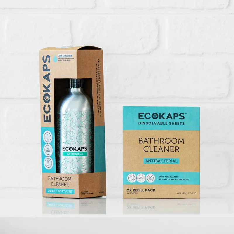 ECOKAPS bathroom cleaner sheet & bottle kit and refill envelope on a white tiled background