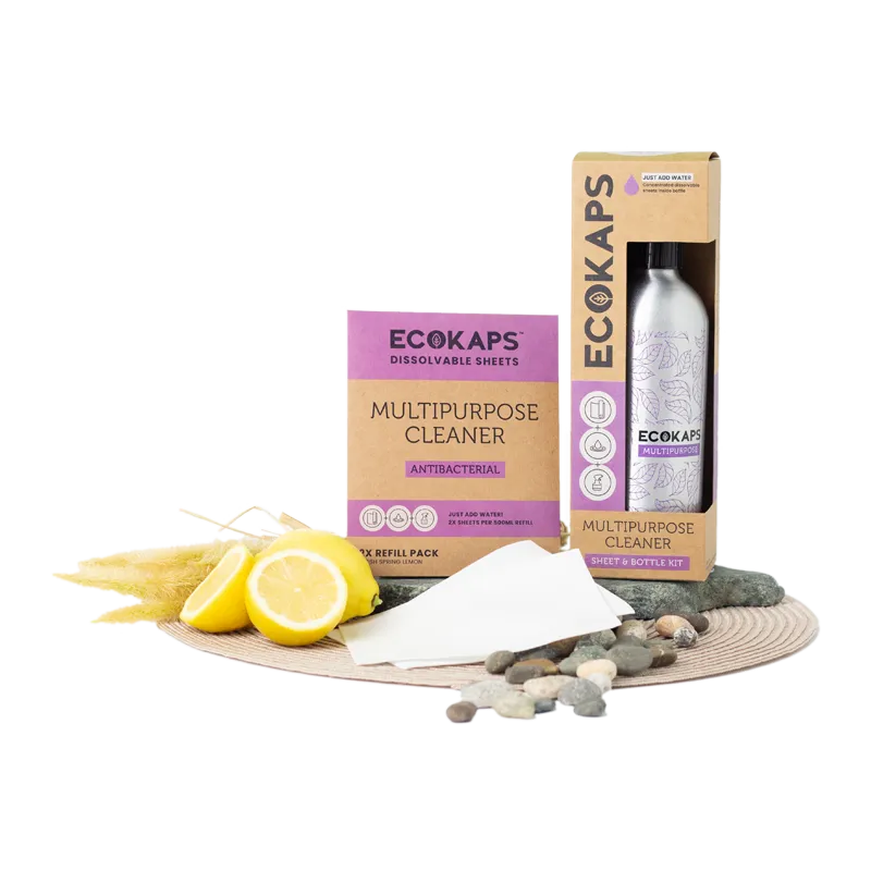 ECOKAPS multipurpose cleaner sheet & bottle kit with lemon slices and stones on a white background